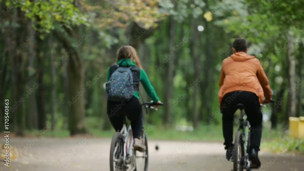 Couple Riding On Bicycles Couple Riding On Bicycles