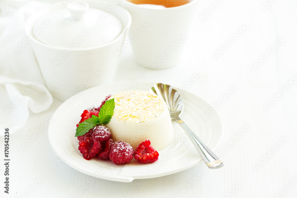 Delicious home-made dessert Panna cotta. Cream-caramel, caramel custard, with raspberries. Delicious home-made dessert Panna cotta. Cream-caramel, caramel custard, with raspberries.