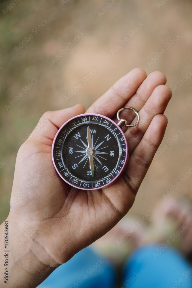Asian boy holding compass Asian boy holding compass