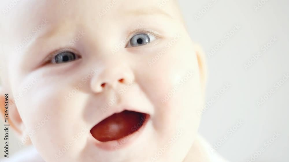 Smiling baby on the light background Smiling baby on the light background