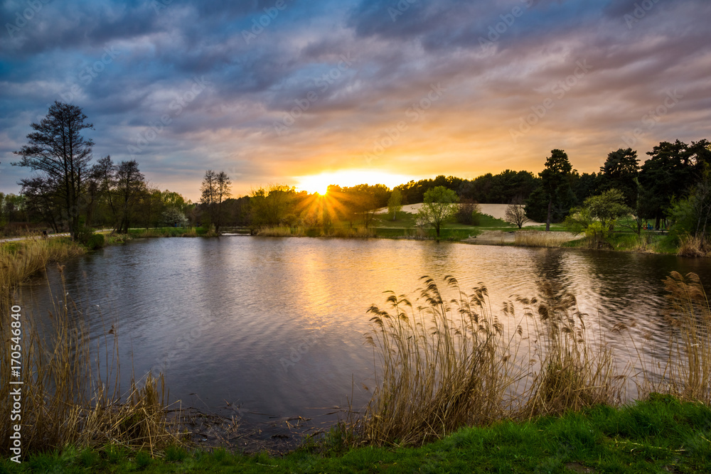 Sunset over pond in Zalesie Dolne, Poland