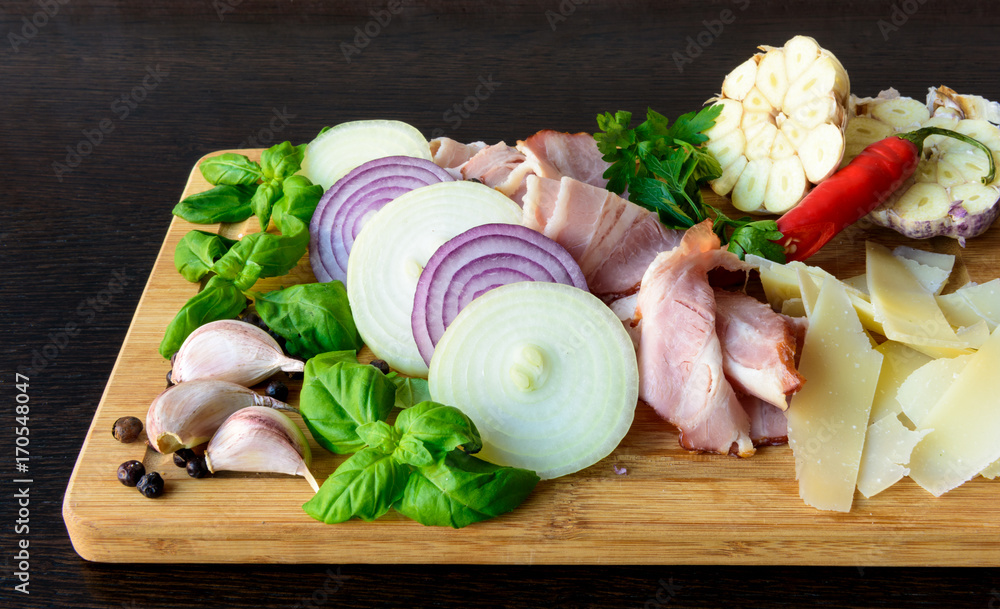Sliced smoked bacon with onion, garlic, cheese, basil Sliced smoked bacon with onion, garlic, cheese, basil