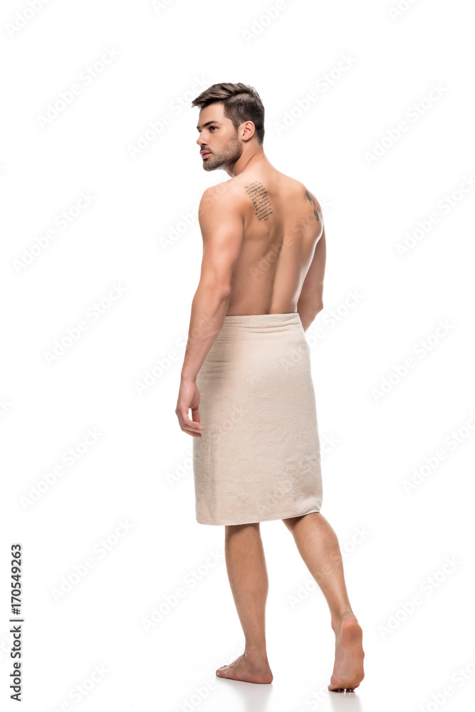 Fototapeta premium man covering with towel after shower