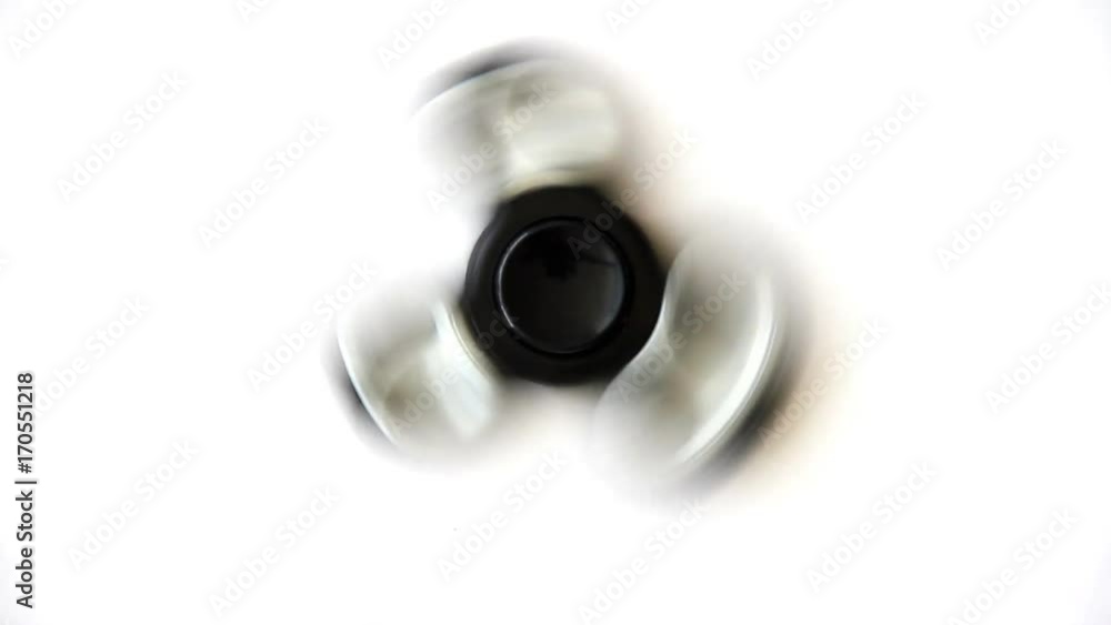 Girl is playing with Fidget Spinner Girl is playing with Fidget Spinner