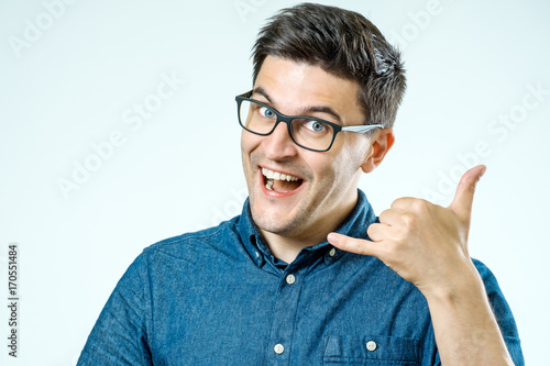 Konstfotografi Call me! Handsome young man showing call me sign