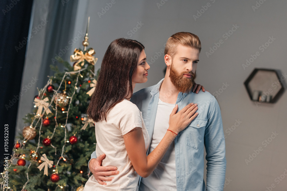young couple at christmastime