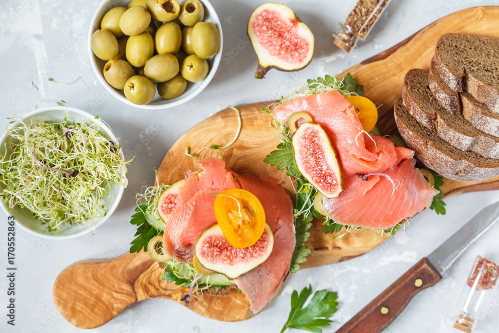 sandwich with fish, rye bread and figs sandwich with fish, rye bread and figs