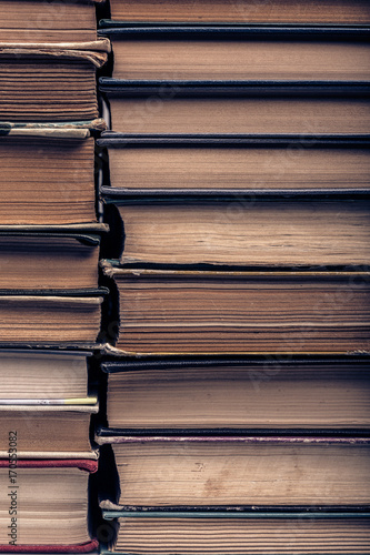 a stack of old tattered books
