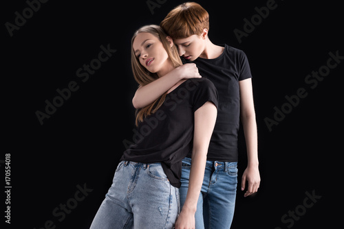 Woman embracing girlfriend from back