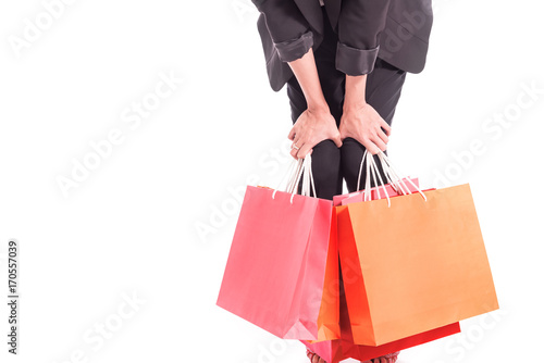 Closed up of Cheerful shopping woman of Asian holding bags. Shopping smart business woman unhappy Bored and tired holding colorful shopping bags isolated on white . Fresh young Asian female model