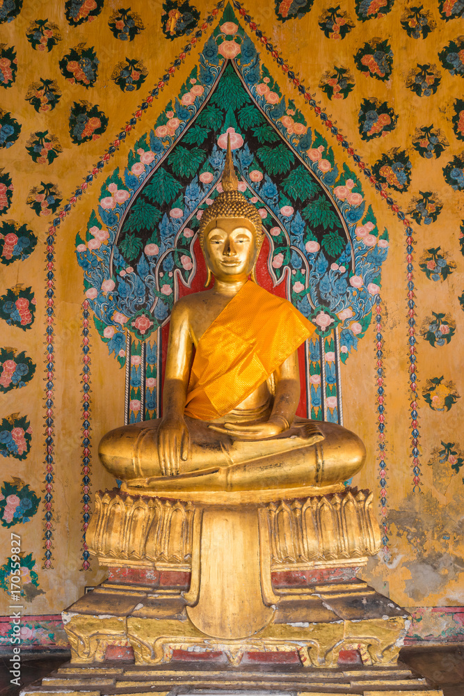 Sitting golden buddha with orange tissue