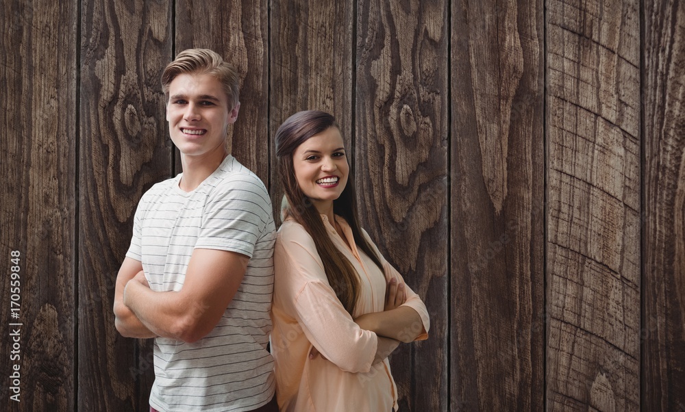 Composite image of young smiling people are posing with crossed Composite image of young smiling people are posing with crossed