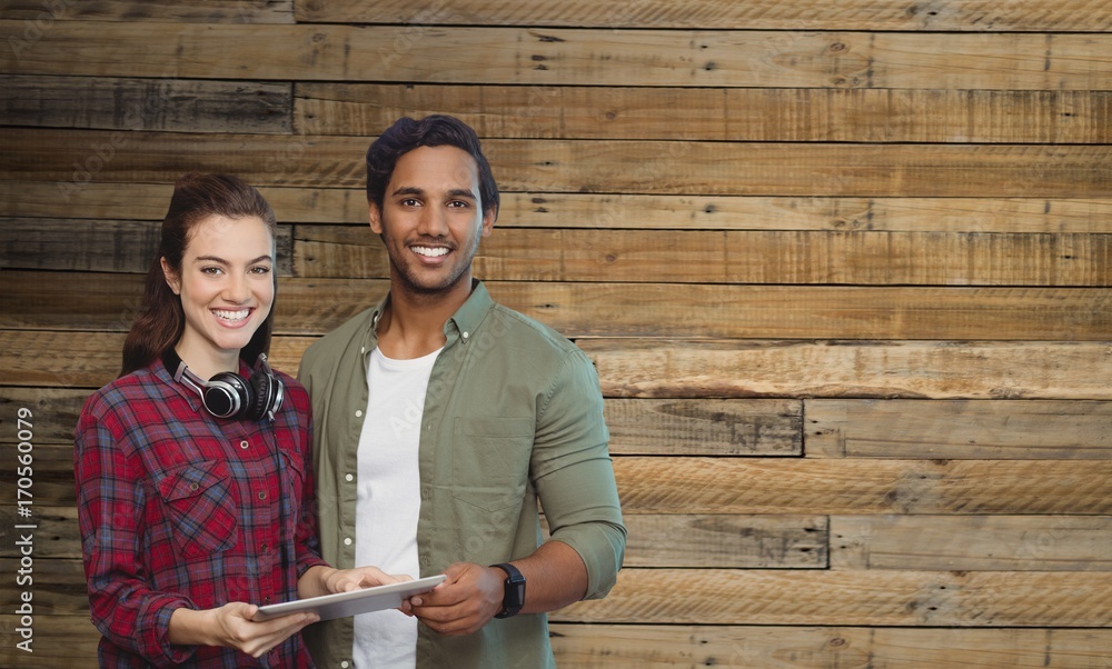 Composite image of portrait of people posing with digital tablet Composite image of portrait of people posing with digital tablet