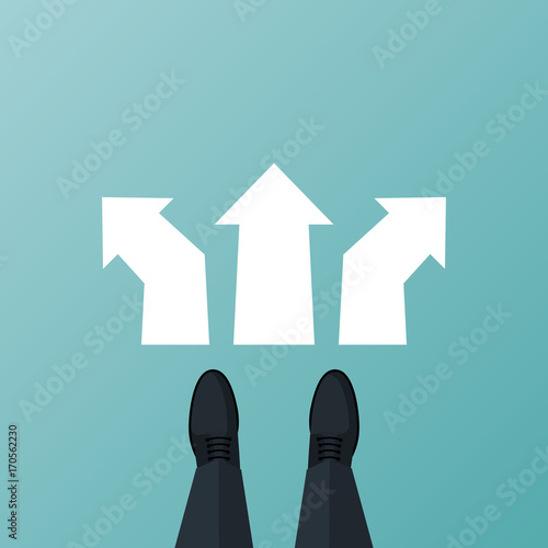 Decide direction. Human standing choice of ways. Shoes on legs of businessman standing in front of arrows. Crossroads arrows. Businessman before choosing. Career path choice or strategy. 