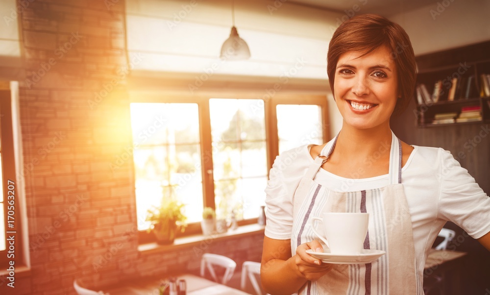Composite image of smiling waitress holding a cup of coffee