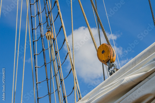 Folded sail and mast on an old sailboat