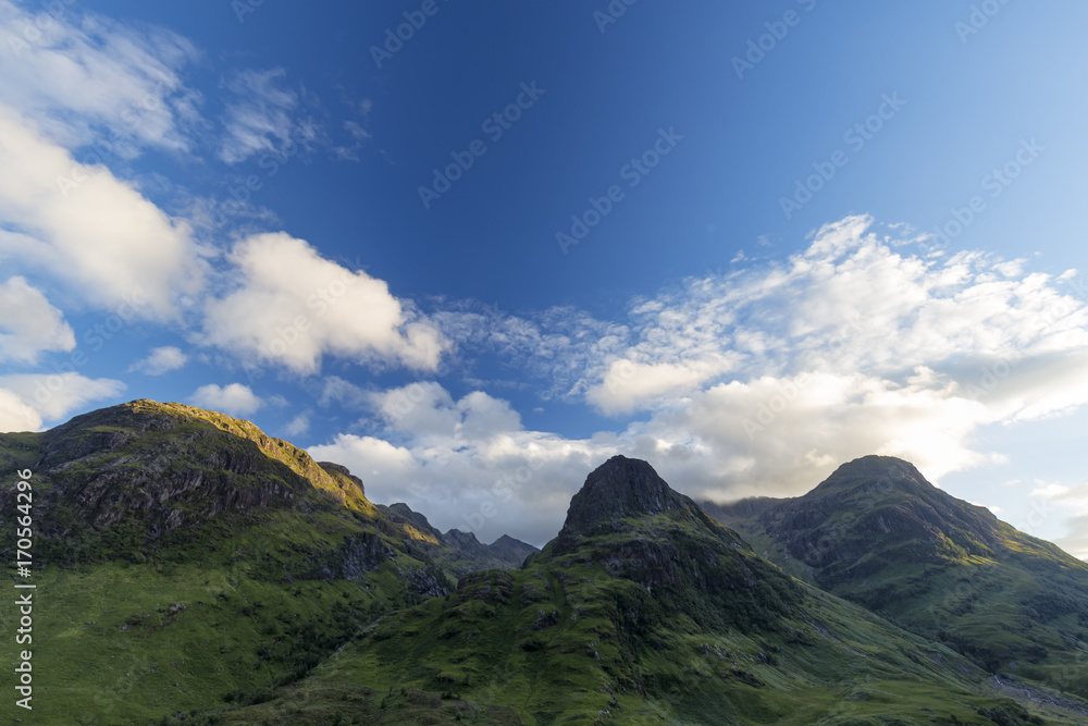 The three sisters Beinn Fhada, Gearr Aonach, and Aonach Dubh as seen from Glen Coe in Scotland.