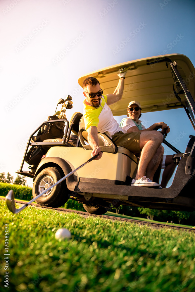 Men playing golf