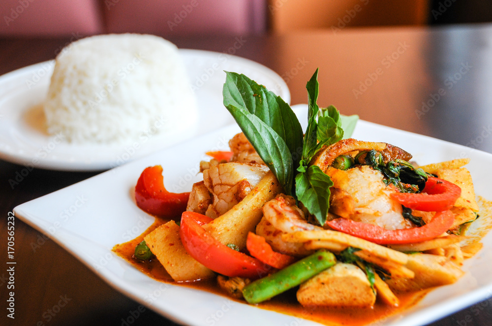 Stir-Fried Spicy Seafood, Stir-fried red curry with shrimp, mussels, scallops, squids, crabmeat, fish balls, bamboo shoots, green beans, basil leaves and eggplant Stir-Fried Spicy Seafood, Stir-fried red curry with shrimp, mussels, scallops, squids, crabmeat, fish balls, bamboo shoots, green beans, basil leaves and eggplant