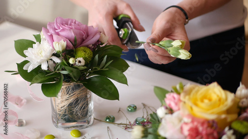 Photography Beautiful young girl shows florist master class on making prekrassnogo bouquet o