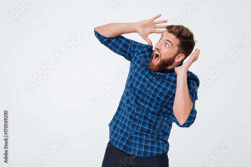 Shocked man scaring and screaming isolated