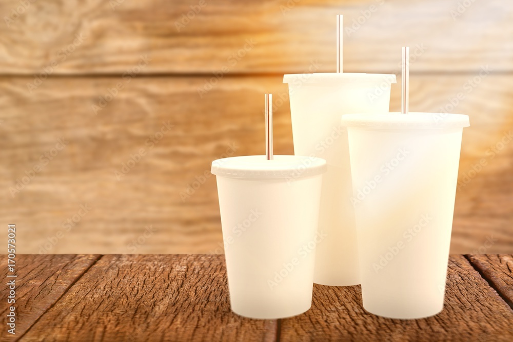 Composite image of white cups over white background Composite image of white cups over white background