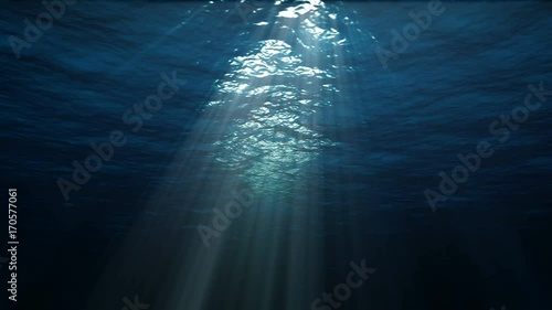 4K blue underwater ocean waves seamless loop animation, light rays pass through the water photo
