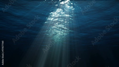 4K blue underwater ocean waves seamless loop animation, light rays pass through the water