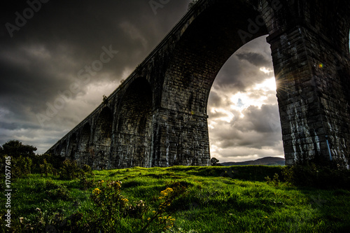 The Creeping Light: by a cloudy and rainy afternoon in a short instant the Sun succeeded to unfold its Light on the land under the Viaduct, Newry, County Down, Northern Ireland, United Kingdom