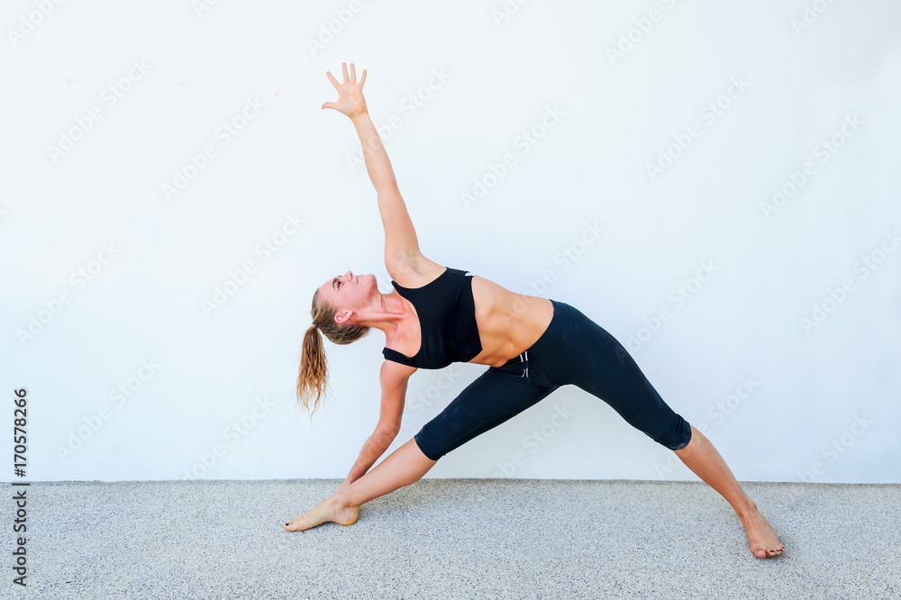 Yoga students showing different yoga poses Yoga students showing different yoga poses