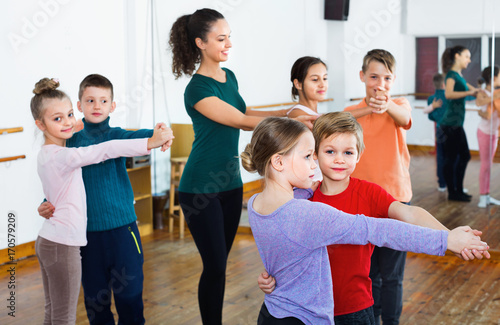 Children studying of partner dance at dance school