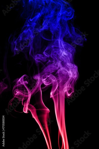 Fototapeta Naklejka Na Ścianę i Meble -  Movement of smoke,Red and blue smoke swirl on black background, Color smoke on black background
