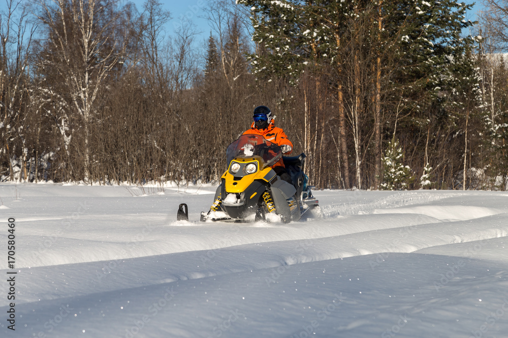 Athlete on a snowmobile