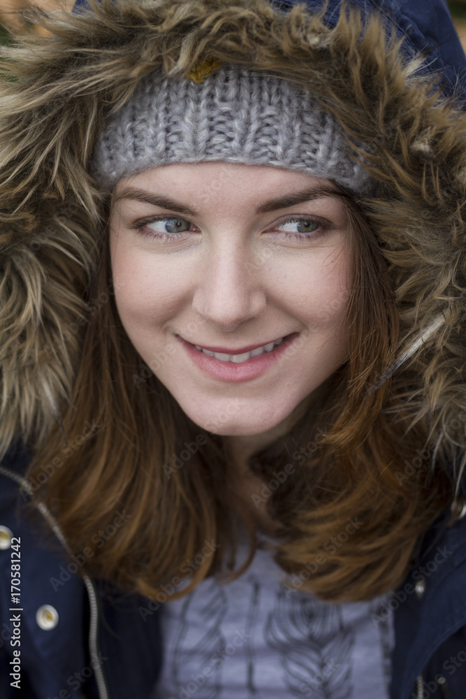Portrait of a young woman wearing hood in autumn. Soft focus Portrait of a young woman wearing hood in autumn. Soft focus