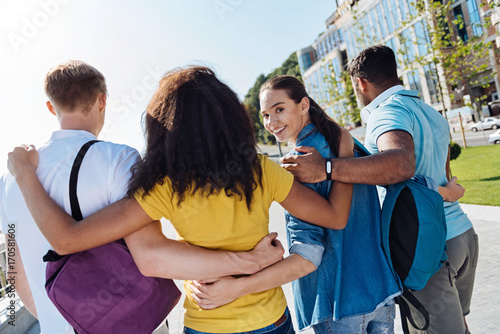 Positive delighted brunette looking at camera