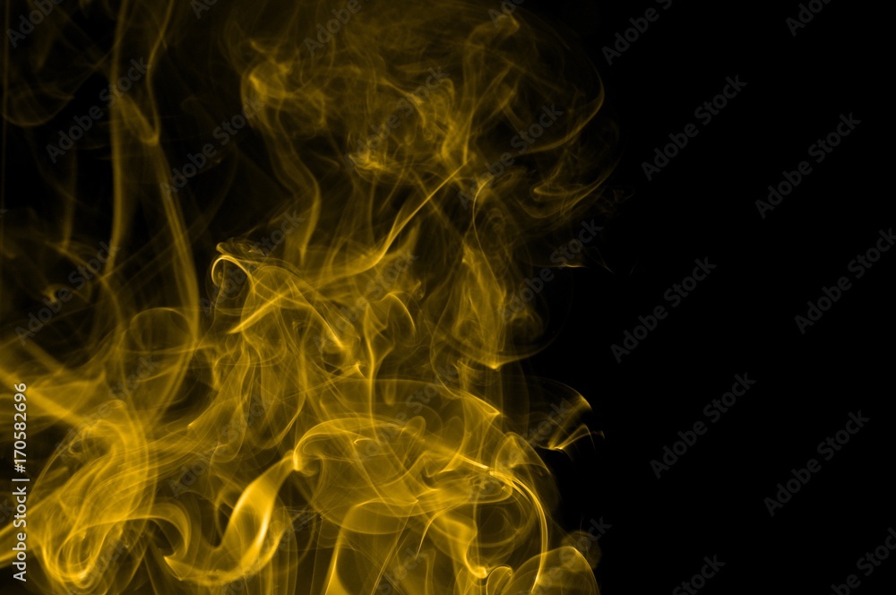 Gold smoke on black background,movement of gold smoke, Abstract gold