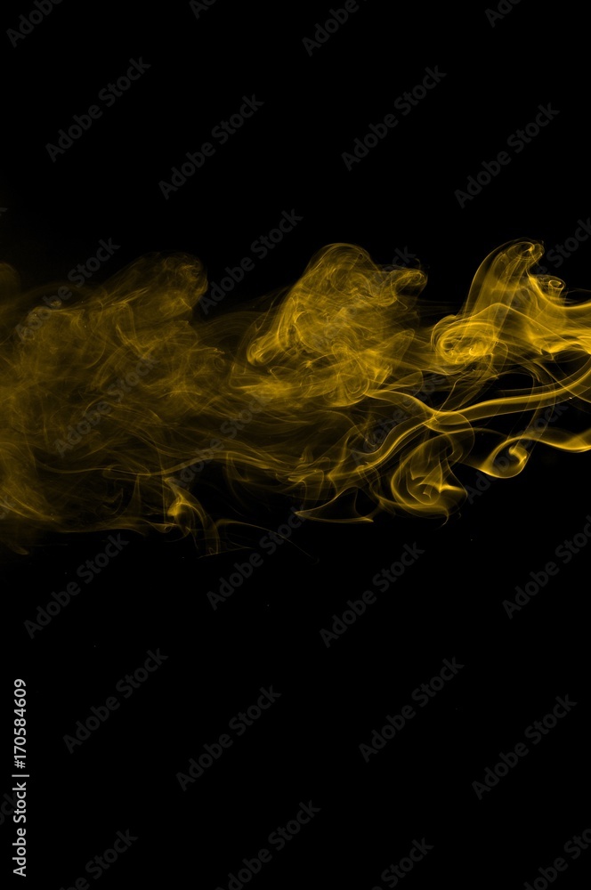 Gold smoke on black background,movement of gold smoke, Abstract gold