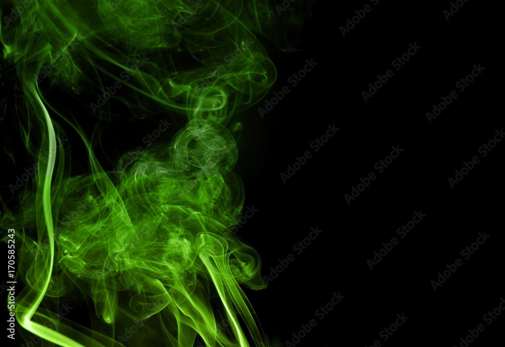 Green colored smoke on a black background, abstract cloud. Smoke design,Abstract green lighting,Green Smoke Green colored smoke on a black background, abstract cloud. Smoke design,Abstract green lighting,Green Smoke
