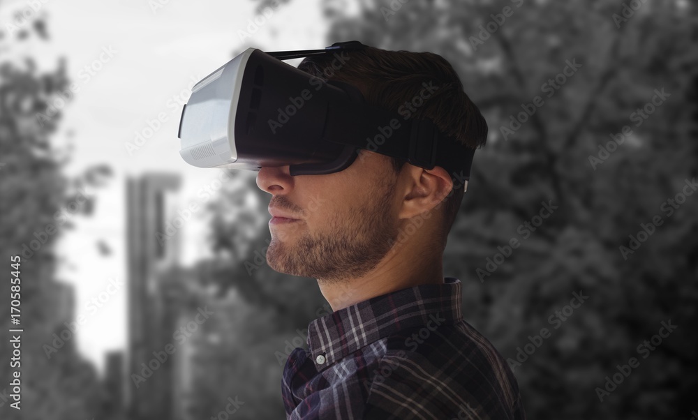 Composite image of side view of young man wearing virtual