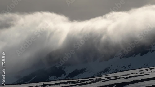 Dramatic Cloud Formation over Lambadalsfjall Mountain in the Westfjords, Iceland photo