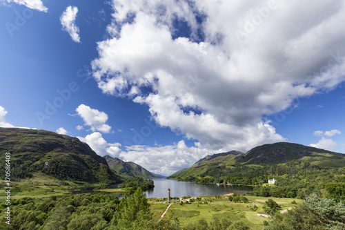 The Glenfinnan monument and Loch Shiel in the background on summer morning in Scotland.