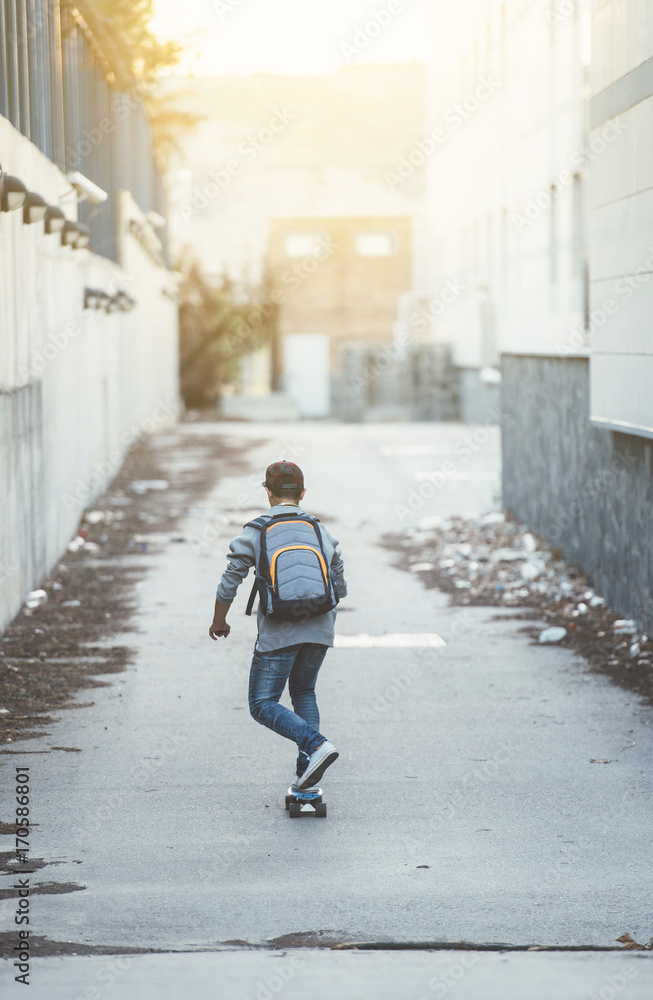 Young man with backpack and skateboard