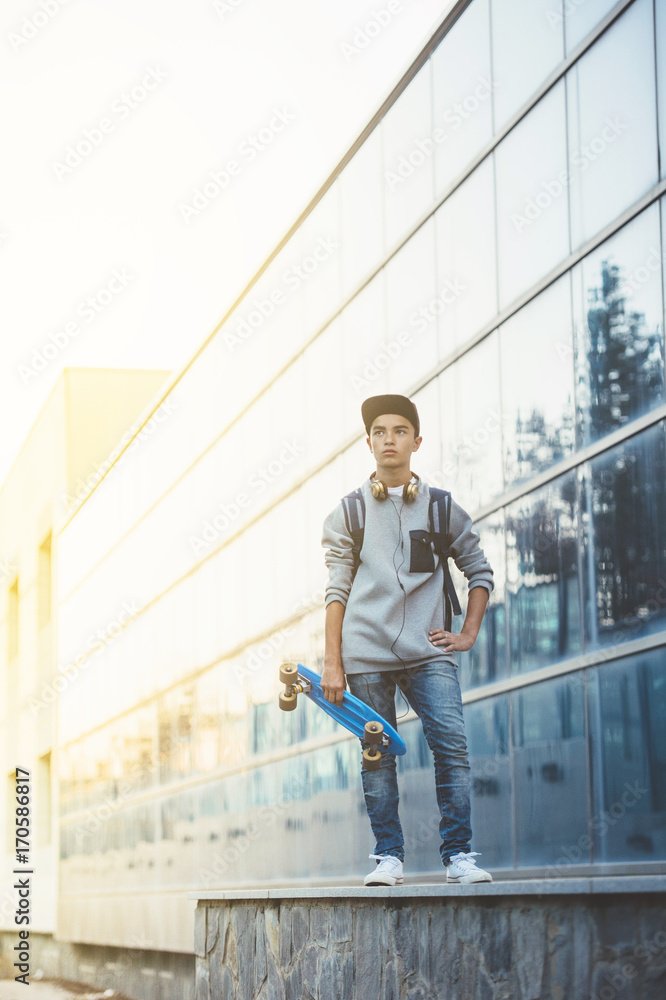 Young man with backpack and skateboard Young man with backpack and skateboard