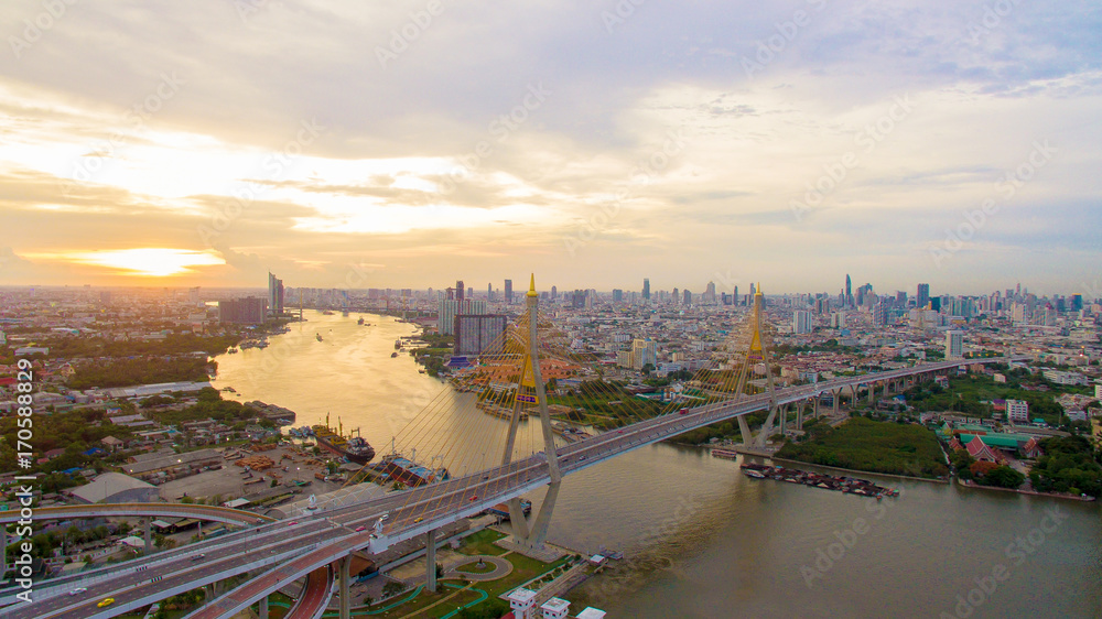 Fototapeta premium aerial view of bhumibol bridge crossing chaopraya river in bangkok