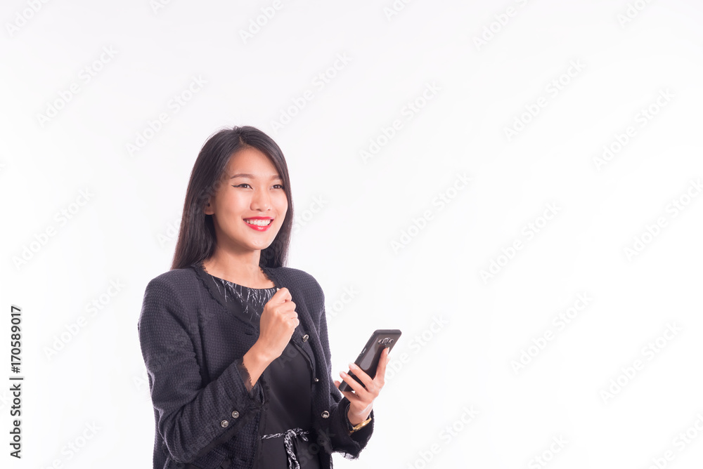 Businesswoman happiness winning after achievement reading a smart phone isolated on white Businesswoman happiness winning after achievement reading a smart phone isolated on white