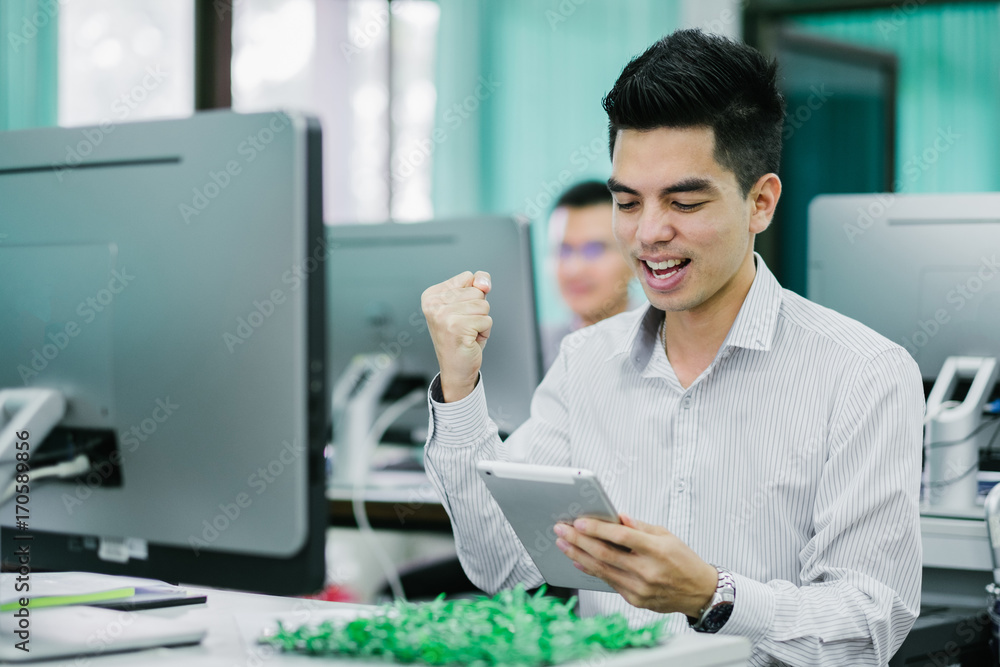 Portrait of handsome young businessman happy rejoicing for his success at office. Asia people businessman. Portrait of handsome young businessman happy rejoicing for his success at office. Asia people businessman.