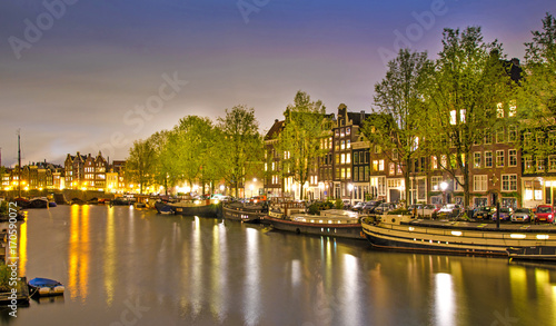 Beautiful evening landscape on the canal in Amsterdam, Netherlands, Europe. © anko_ter