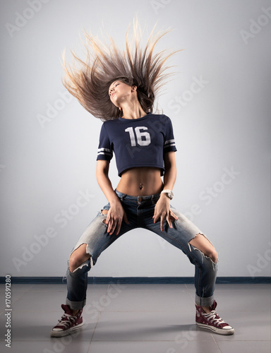 Canvas Print modern young beautiful dancer posing on a studio background
