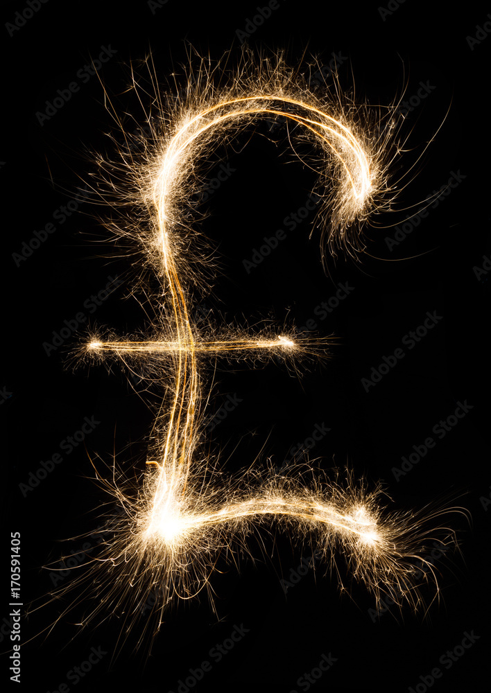 Sparkler pound sterling symbol on black background Sparkler pound sterling symbol on black background
