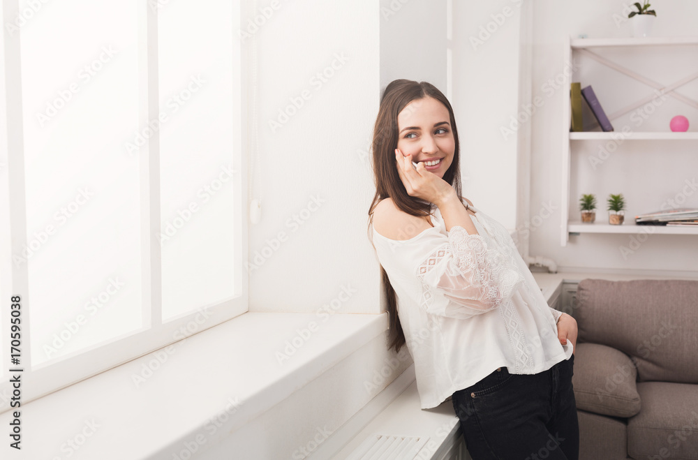 Happy woman talking on mobile phone Happy woman talking on mobile phone